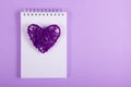 Wicker Valentine and white notes on a purple background. Handmade. Valentine`s Day.