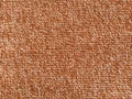 Wicker warm plaid close-up. The threads are brown, red and orange. Fabric or knit texture Royalty Free Stock Photo