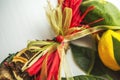 Wicker wreath with heart-shaped, decorated with leaves, lemon, dried lemon