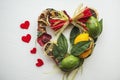 Wicker wreath with heart-shaped, decorated with leaves, lemon, dried lemon Royalty Free Stock Photo