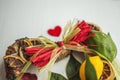 Wicker wreath with heart-shaped, decorated with leaves, lemon, dried lemon