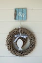 Wicker wreath with white wooden fish