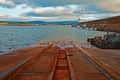 Wicklow Harbor Boat Launch next North Pier Breakwater wall and Lighthouse Royalty Free Stock Photo