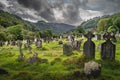 Ancient graves with Celtic crosses in Glendalough Cemetery, Wicklow, Ireland