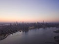 Wide Aerial Drone View of Manhattan Skyline with East River in New York City at Dusk and City Lights Royalty Free Stock Photo