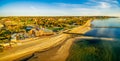 Wide aerial panorama of Frankston yacht club, footbridge, and pier at sunset. Royalty Free Stock Photo