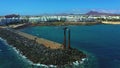 Wide aerial view of a beautiful statue on a water dem in Lanzarote island, Spain.