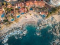 Wide aerial view of Conchas Chinas Beach in Puerto Vallarta Mexico. Villas, waves, turquoise water