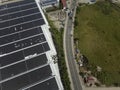 Wide aerial view of a massive building with solar panels installed on the entire roof at Cavite Export Processing Zone in Rosario Royalty Free Stock Photo