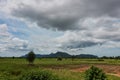 Wide angel shot of beautiful green mountain and dramatic cloud sky scenery Royalty Free Stock Photo