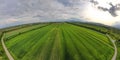 Wide angle Aerial shot from a drone of young green wheat in Spring Royalty Free Stock Photo