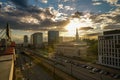 Wide angle aerial view of Lodz cityscape with mix of modern and medieval architecture next to highway against dramatic sunset Royalty Free Stock Photo