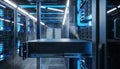 Wide-angle cinematic shot of a high density data center with rackmount console blue fiber optic cables and server infrastructure Royalty Free Stock Photo