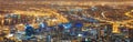 Wide angle of a city at night from above. Futuristic panorama of the lights of Cape Town at sunset. .A modern urban Royalty Free Stock Photo