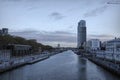 Wide angle cityscape view on the Brussels Havenlaan canal with skyscraper and apartments