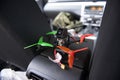 Wide angle close up of small racing drone, ready to fly, in a car Royalty Free Stock Photo