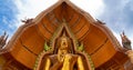 Wide-angle closeup of golden big blessing buddha statue at Wat Tham Sua temple Royalty Free Stock Photo