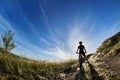 Wide angle of the cyclist with mountain bicyclist against beautiful landscape. Royalty Free Stock Photo