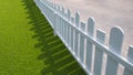 White wooden picket with green artificial turf in front yard area Royalty Free Stock Photo