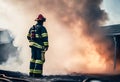 Wide angle, firefighter standing among heavy smoke during work