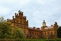 Wide-angle landscape of Chernivtsi University. Ancient brown brick building with inner yard.