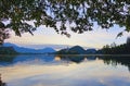 Wide-angle landscape view of famous Bled Lake with mountain range in the background. Popular travel destination in Slovenia Royalty Free Stock Photo