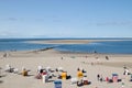 Wide angle look on the beach with the beach chairs