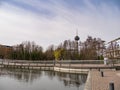 Wide-angle over lake at Mediapark, Cologne, Germany Colonius Fernsehturm communications tower