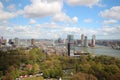 Wide angle overview at 100 metres height over the Rotterdam Skyline with blue sky and white rain clouds Royalty Free Stock Photo