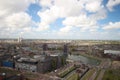 Wide angle overview at 100 metres height over the Rotterdam Skyline with blue sky and white rain clouds Royalty Free Stock Photo