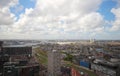 Wide angle overview at 100 metres height over the Rotterdam Skyline with blue sky and white rain clouds Royalty Free Stock Photo