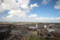 Wide angle overview at 100 metres height over the Rotterdam Skyline with blue sky and white rain clouds Royalty Free Stock Photo