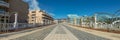 Wide angle panorama. Absolutly empty wide pedestrian street in the tourist resort Playa de las Americas. No tourists, all people Royalty Free Stock Photo