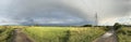 Panorama of a country rural road in green fields in Poland Royalty Free Stock Photo