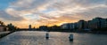 Wide angle panorama of sunset over River Liffey in Dublin, Ireland with silhouetted buildings