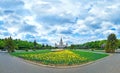 Wide angle panoramic view of spring flowers blossoming in  campus of famous Russian university in Moscow under dramatic sky Royalty Free Stock Photo