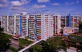 Bright colorful HDB flats buildings in Singapore, against cloudy blue sky Royalty Free Stock Photo