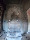 Wide angle picture of buddha statue in angor wat ruins, cambodia