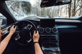 Wide angle point of view of driver on mountain roads. Winter background and snowy roads