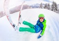 Wide angle portrait of boy with ski sit in snow Royalty Free Stock Photo