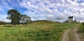 Wide angle Scottish landscape with white Corgarff Castle