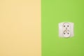 Electric socket on green painted wall Royalty Free Stock Photo