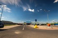 Wide angle shot , Decathlon store front, blue sky with white clouds.