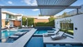 Wide-Angle Shot of Modern House Exterior Pool Side. Mid-Century Architecture Design Idea of Swimming Pool and Landscaping. Royalty Free Stock Photo