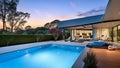 Wide-Angle Shot of Modern House Exterior Pool Side. Mid-Century Architecture Design Idea of Swimming Pool and Landscaping. Royalty Free Stock Photo