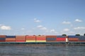 Wide angle shot of multicolored boxes next to the water