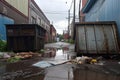 wide-angle shot of overflowing dumpster in urban area