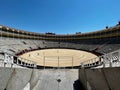 Wide angle shot of people walking in the Las Ventas Bullring in Madrid under the blue sky Royalty Free Stock Photo