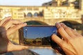 Wide angle shot of a person taking a photo of a building