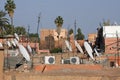 Wide angle shot of satellite dishes on the buildings of a city Royalty Free Stock Photo